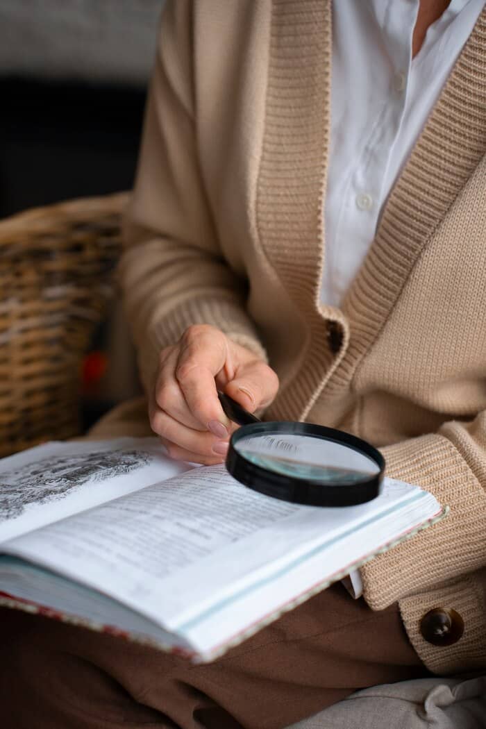 elderly-woman-reading-while-using-magnifying-glass elderly-woman-reading-while-using-magnifying-glass